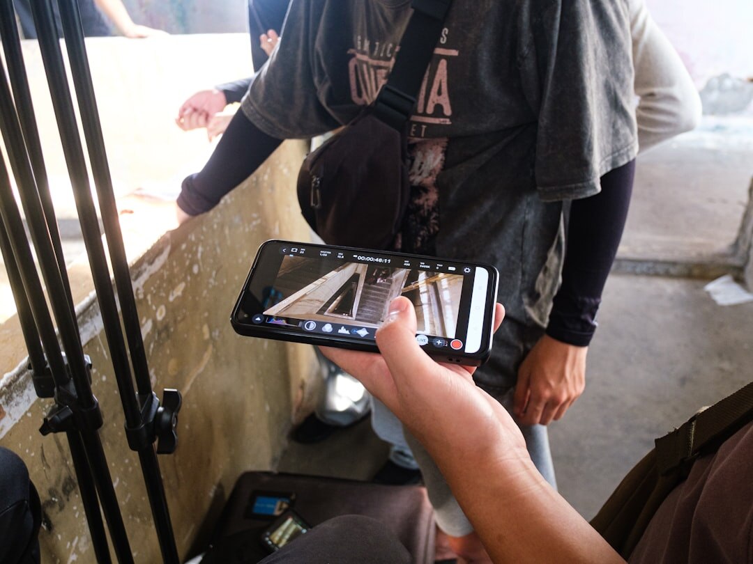 Producer reviewing a production timing rundown on a tablet