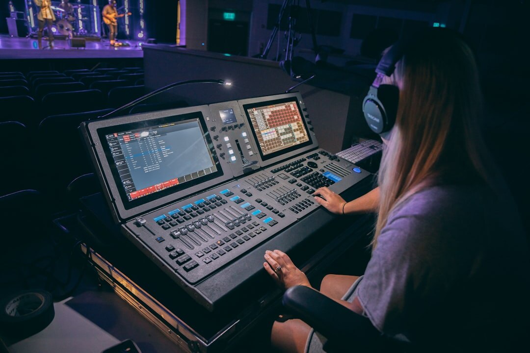 Broadcast control room with multiple live video feed monitors