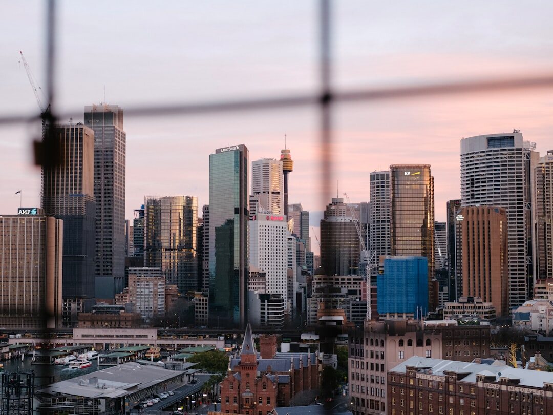 Sydney city skyline at dusk with lit office towers