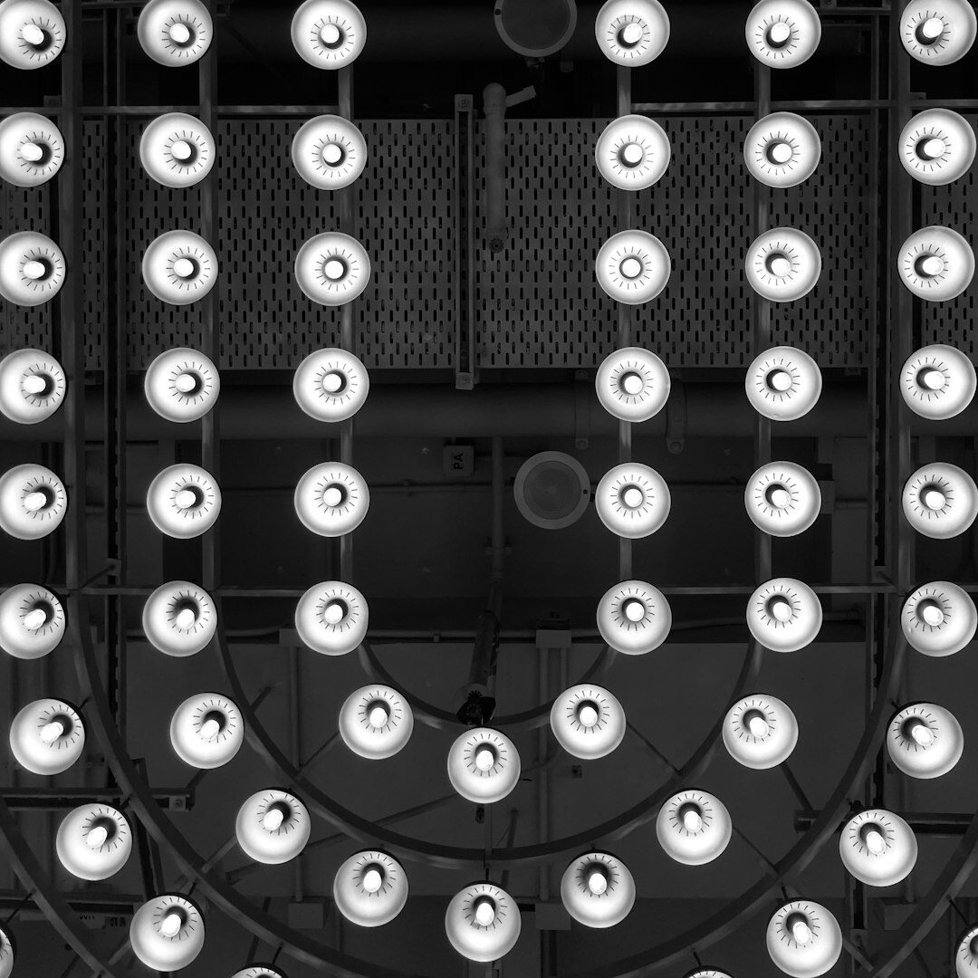 Close-up of a video switcher panel with glowing buttons